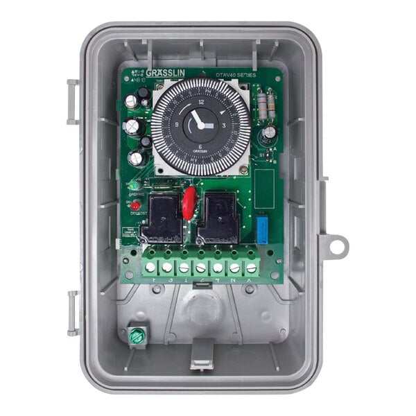 A Heatcraft DTAV40 electric timer with a clock and circuit board.