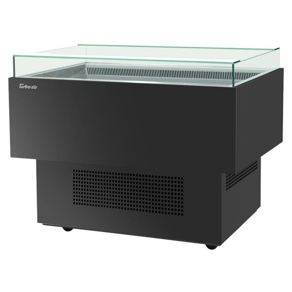 A black Turbo Air open display case with a glass top.