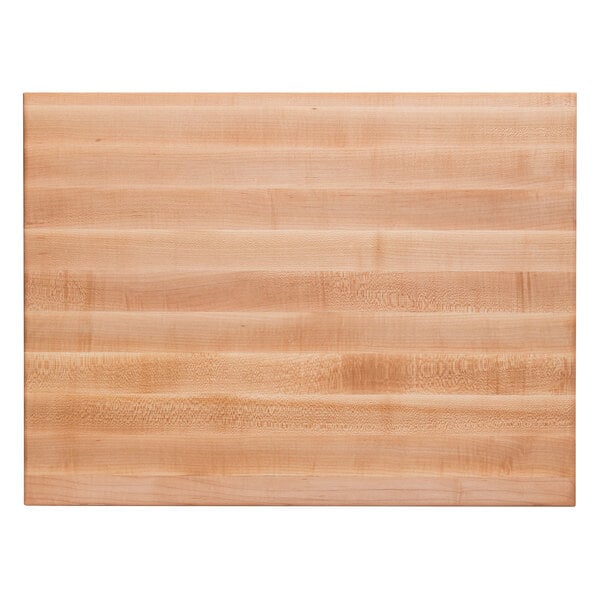 A close up of a John Boos maple wood cutting board with hand grips.