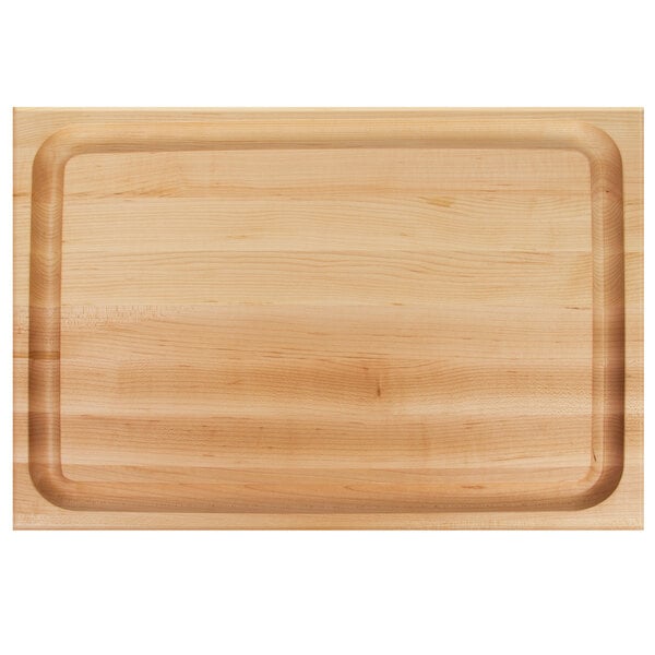 A John Boos maple wood cutting board with hand grips.