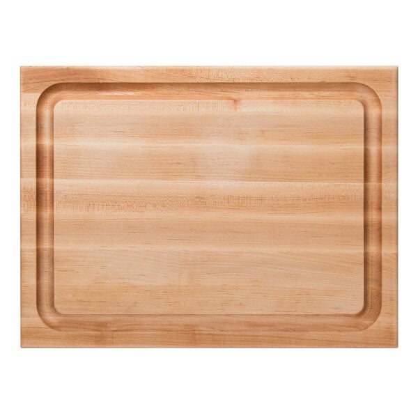 A John Boos maple wood cutting board with hand grips.