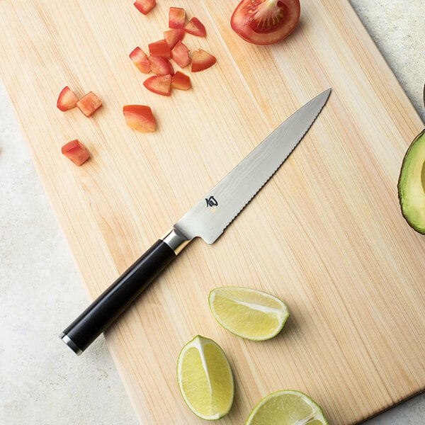 a lemon wedge on a wood surface