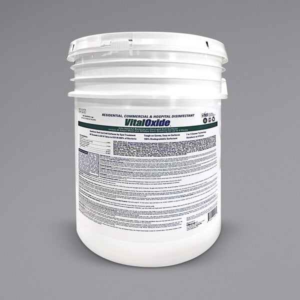 A white bucket of Simpson Vital Oxide disinfectant with a label.