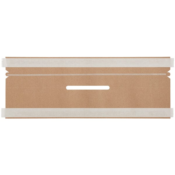 A brown cardboard box with white rectangular objects and a white line.
