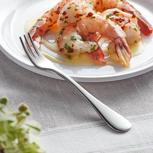 A plate of shrimp with sauce and an Acopa Vernon cocktail/oyster fork.