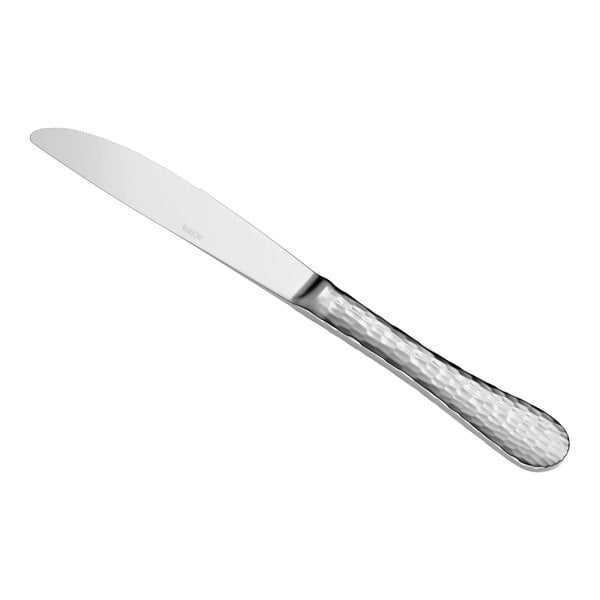 A stainless steel table knife with a textured handle and a smooth, slightly serrated blade.