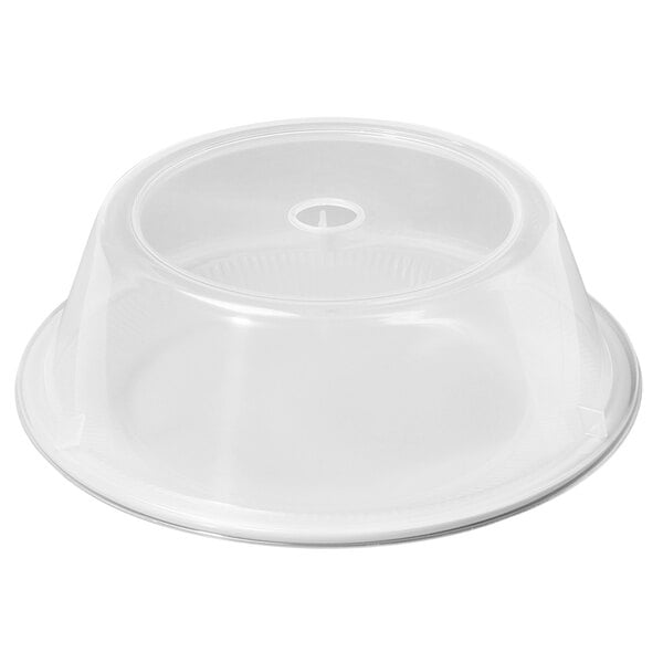 A clear plastic lid on a white surface.