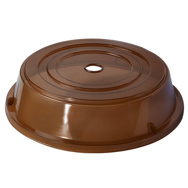 A brown plastic lid with a hole.