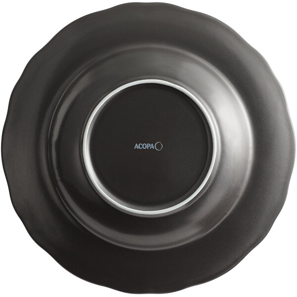 An Acopa Armor Gray porcelain pasta bowl with a scalloped rim in matte black with a silver edge.