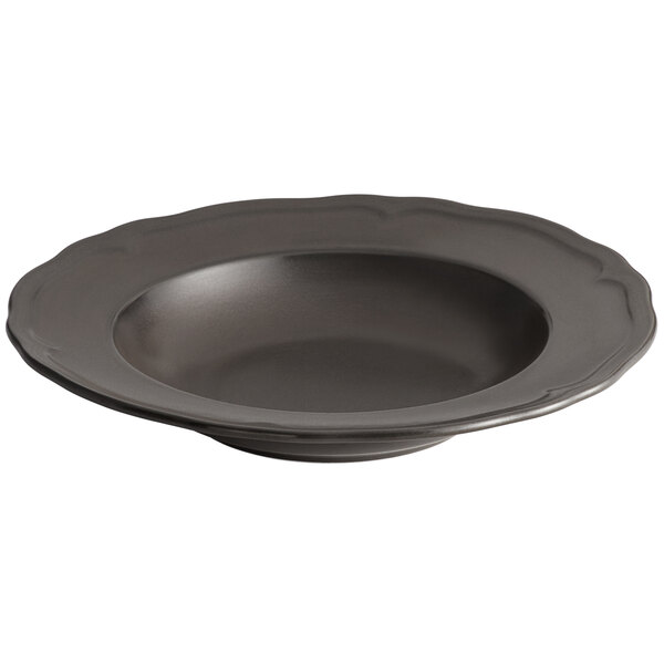 An Acopa Armor Gray porcelain pasta bowl with a scalloped edge.