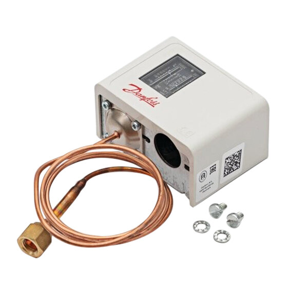 A Heatcraft low pressure control device in a white box with a copper pipe and a nut.