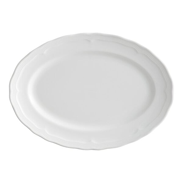 An oval pearl white porcelain platter with a scalloped wide rim.