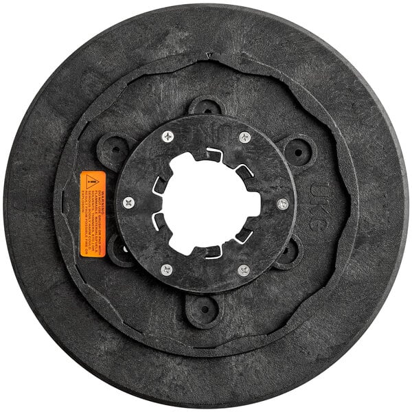 A black circular Lavex floor scrubbing brush with a hole in the middle.