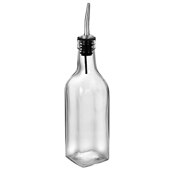 An Anchor Hocking clear glass oil and vinegar bottle with a metal spout.