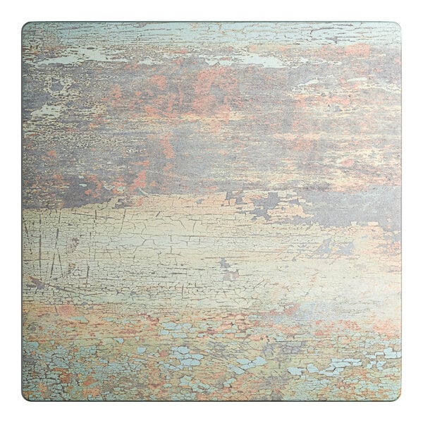 A square table top with a textured canyon painted faux metal finish.