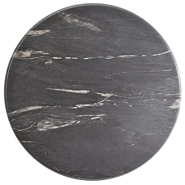 A Lancaster Table & Seating black and white marbled table top.