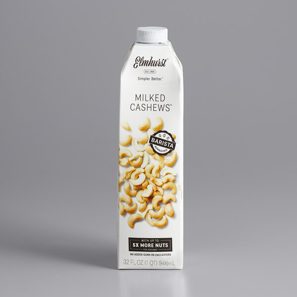 A white and blue carton of Elmhurst Milked Cashews with a close up of the logo.