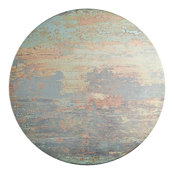 A 32-inch round table top with a textured canyon painted faux metal finish.