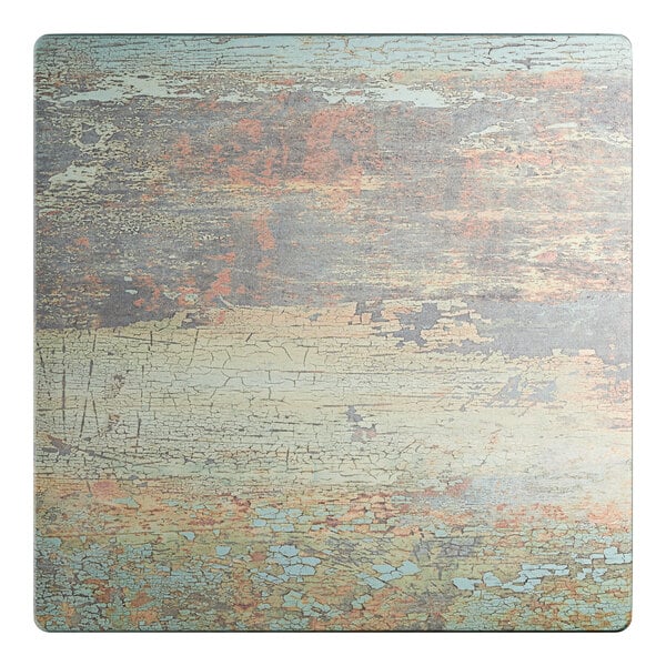 A square table top with a textured canyon painted faux metal finish in a distressed style.