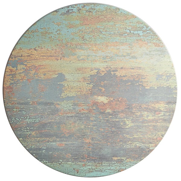 A Lancaster Table & Seating round table top with a textured canyon painted finish.