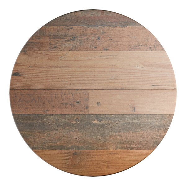 A round wooden table top with a textured farmhouse finish.