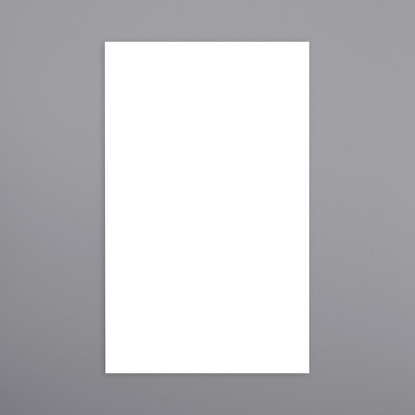 A white rectangular Ishida scale label roll with a black border on a gray background.