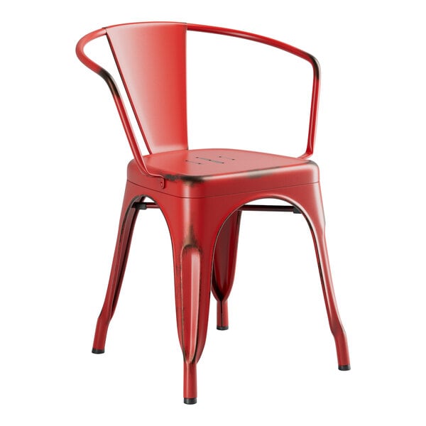A red Lancaster Table & Seating outdoor arm chair with metal arms and back.