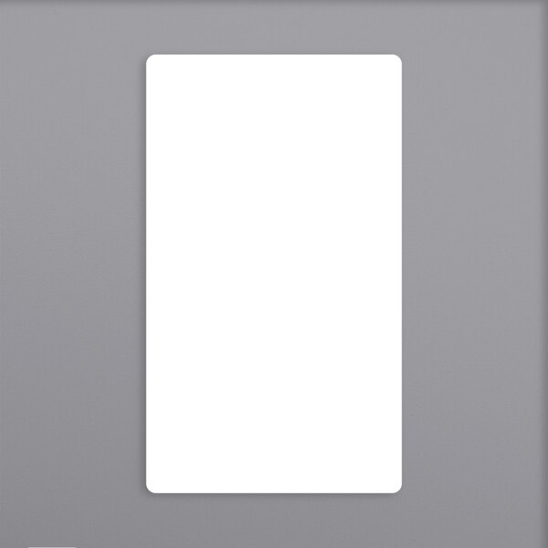 A white rectangular Berkel scale label on a gray surface.
