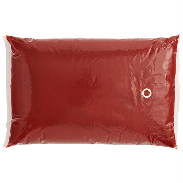 A red plastic pouch with a white circle containing French's Ketchup.