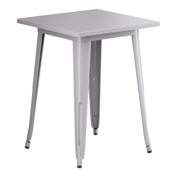 A nickel gray metal table with legs.