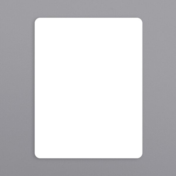 A white rectangular Berkel equivalent scale label roll with a black border on a gray surface.