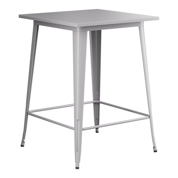 A gray metal square bar height table.