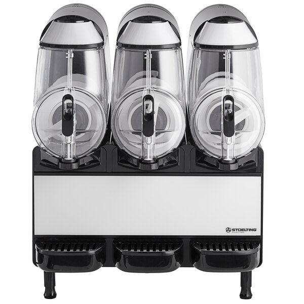 A Stoelting frozen beverage machine with three clear plastic containers.