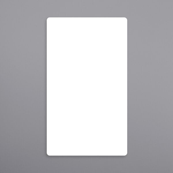 a white rectangular object on a gray surface