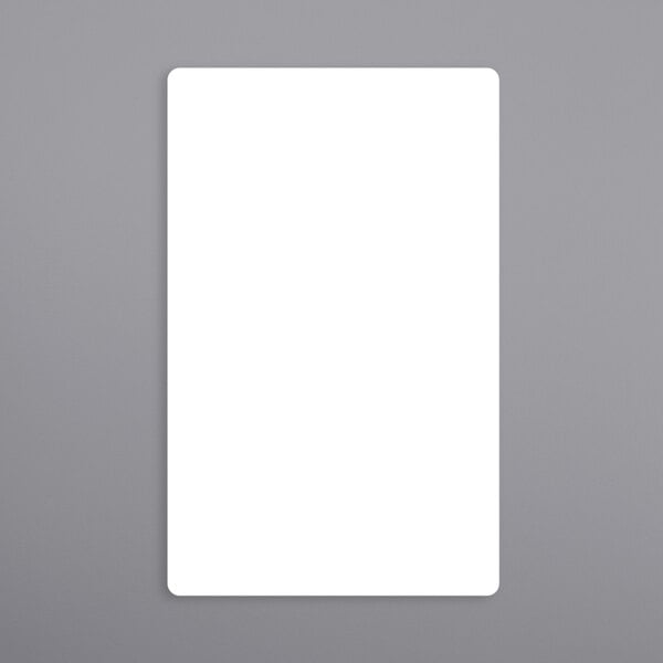A white rectangular label with a black border on a gray surface.