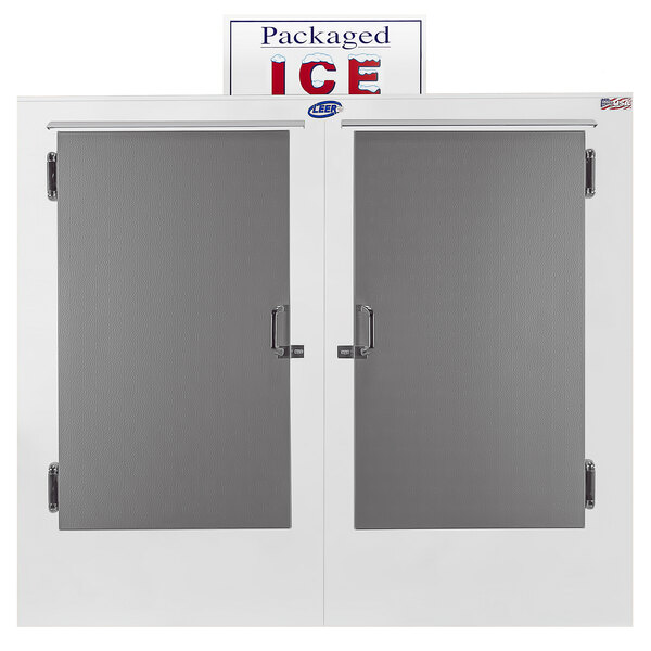 A white double door Leer ice merchandiser with grey glass doors and the words "Packaged Ice" on them.