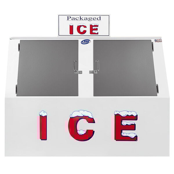 A white Leer ice merchandiser with a sign and two doors.