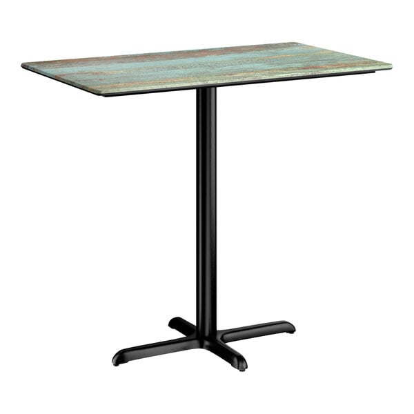 A rectangular bar height table with a textured faux metal finish top and a black cross base plate.