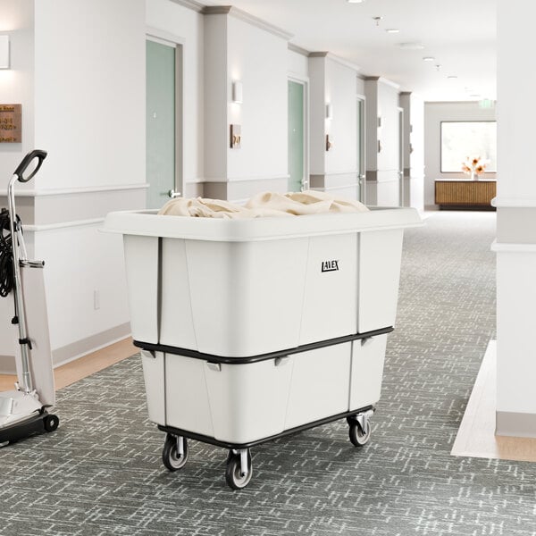 A large white leakproof cube truck with a 16 cubic foot capacity, designed for transporting laundry or materials.