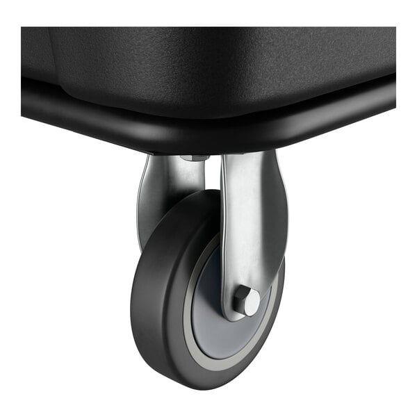 A close-up of a caster wheel attached to a black Lavex 8 cubic foot cube truck.