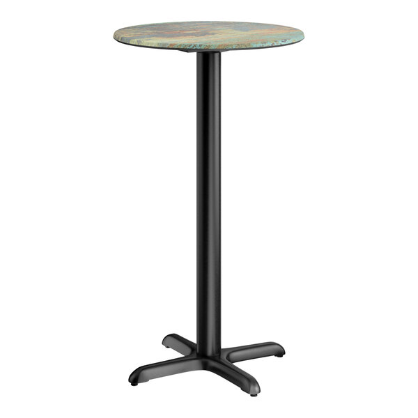 A round bar height table with a textured canyon painted faux metal finish top and a black cross base plate.