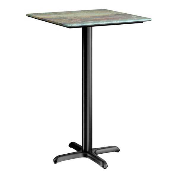 A square bar height table with a textured faux metal finish top and a black cross base plate.