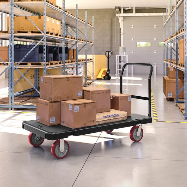 A Suncast platform truck with cardboard boxes on it.