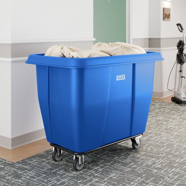 A large blue Lavex cube truck with a 12 cubic foot capacity, designed for transporting items and shown partially filled with linens.