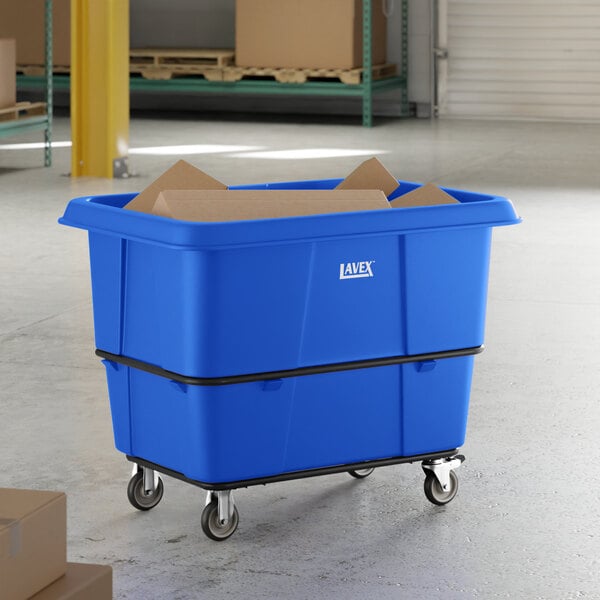 A large blue Lavex cube truck with a 20 cubic foot capacity and wheels, used for transporting materials in industrial settings.