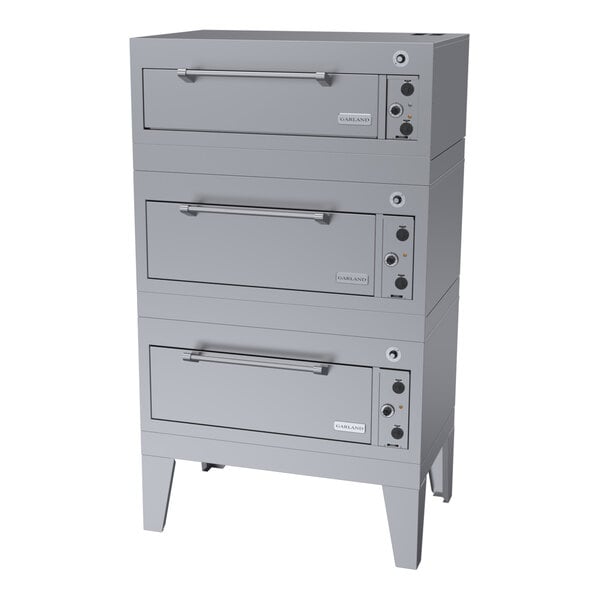 A triple deck commercial roast and bake oven with three stacked compartments and control knobs on the right side.