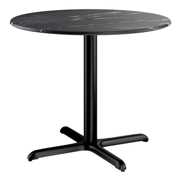 A round standard height table with a smooth black finish and a cross base plate.