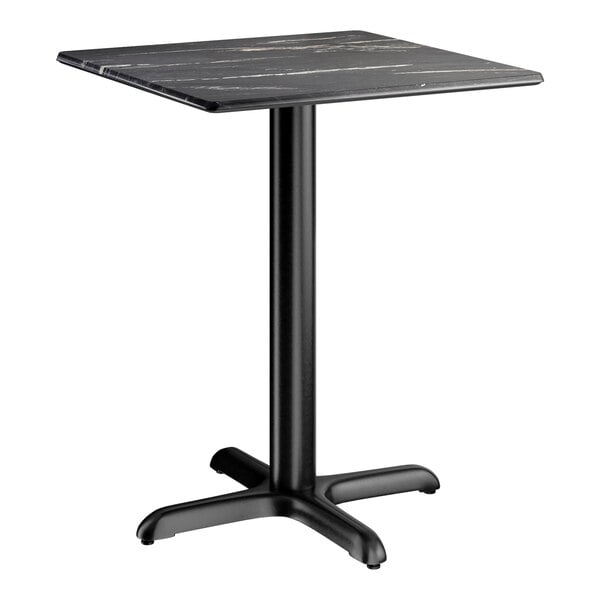 A square standard height table with a smooth black finish and a cross base plate.