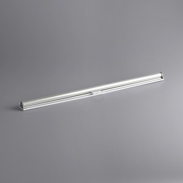 a long silver tube on a gray background