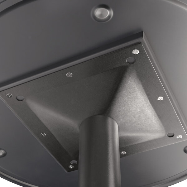 A close up of a Lancaster Table & Seating metal table top with a textured black finish.